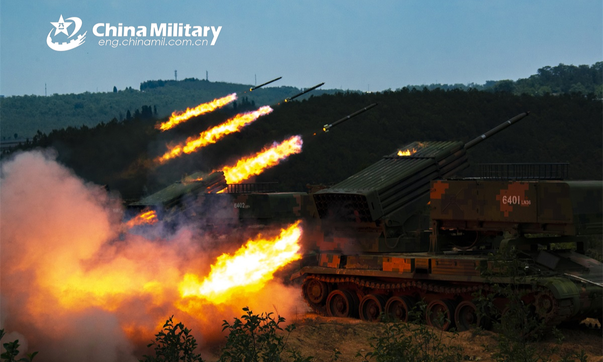 Armored vehicles attached to a combined-arms brigade under the PLA 75th Group Army fire rockets at the mock targets during a live-fire training exercise on May 19, 2022. Photo: China Military