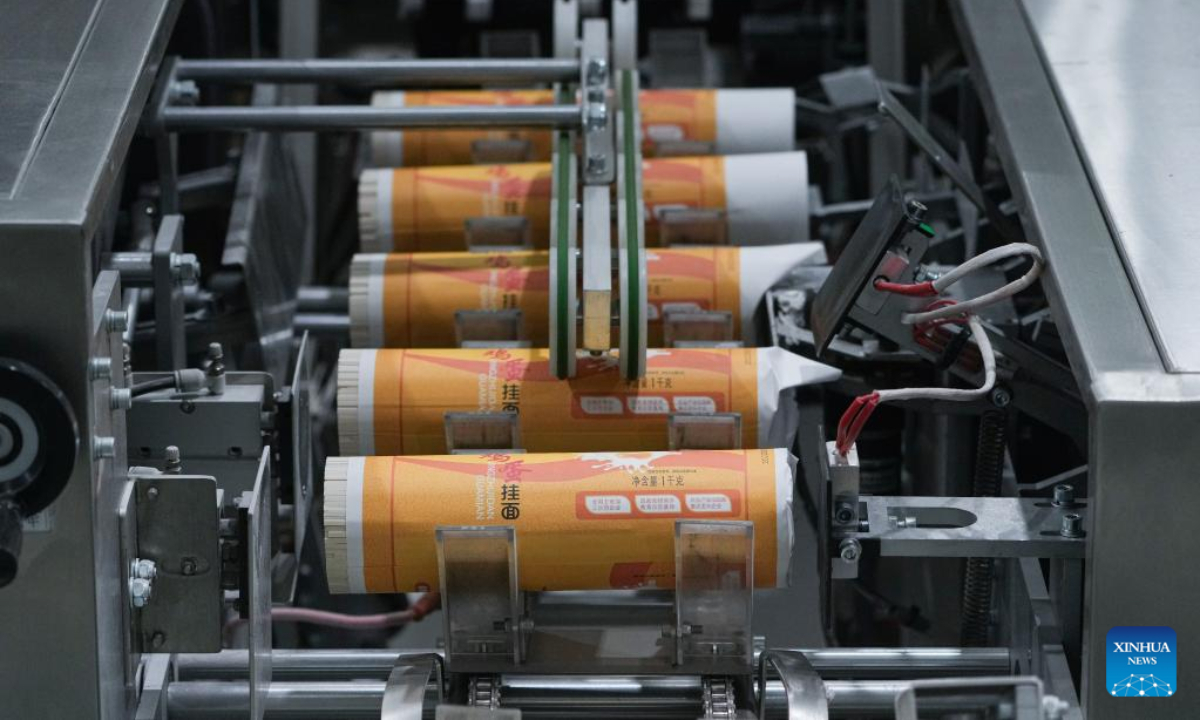 Packs of fine dried noodles are seen on the production line at a wheat processing plant in Woyang County of Bozhou City, east China's Anhui Province, June 7, 2022. Photo:Xinhua