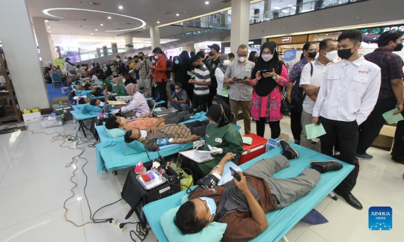 People participate in blood donation to mark World Blood Donor Day at a shopping center in Surakarta, Central Java, Indonesia, June 14, 2022. Established in 2004, World Blood Donor Day is marked every year on June 14 to raise awareness of the need for this life-saving gift. (Photo by Bram Selo/Xinhua)