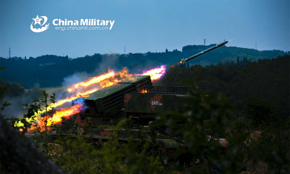 Armored vehicles attached to a combined-arms brigade under the PLA 75th Group Army fire rockets at the mock targets during a live-fire training exercise on May 19, 2022. (eng.chinamil.com.cn/Photo by Tang Zhoutao)