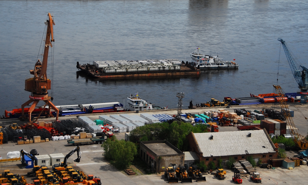 A barge nears the Heihe port in Northeast China's Heilongjiang Province as Heihe-Blagoveshchensk, Russia cross-border dry bulk cargo water transport began on June 12, 2022. Five barges with displacements of 1,000 tons and one with 600 tons took part. Due to weather conditions, the port is only accessible 240 days a year. Photo: VCG