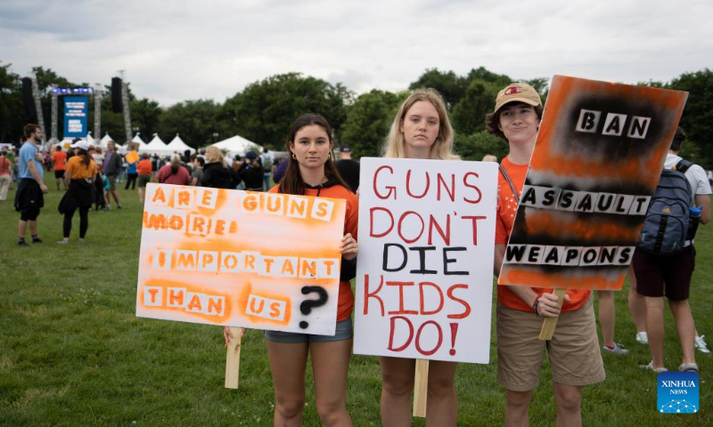 People gather during a rally decrying rising gun violence while urging politicians to take action in Washington, D.C., the United States, June 11, 2022. (Xinhua/Liu Jie)