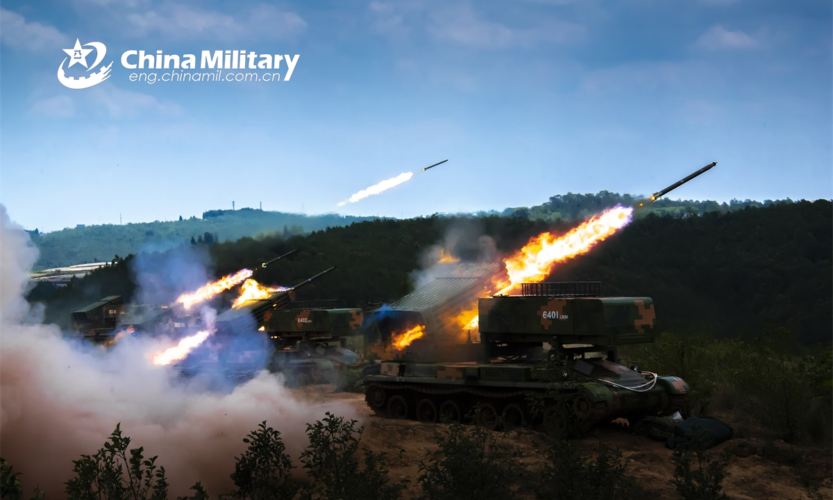 Armored vehicles attached to a combined-arms brigade under the PLA 75th Group Army fire rockets at the mock targets during a live-fire training exercise on May 19, 2022. (eng.chinamil.com.cn/Photo by Tang Zhoutao)