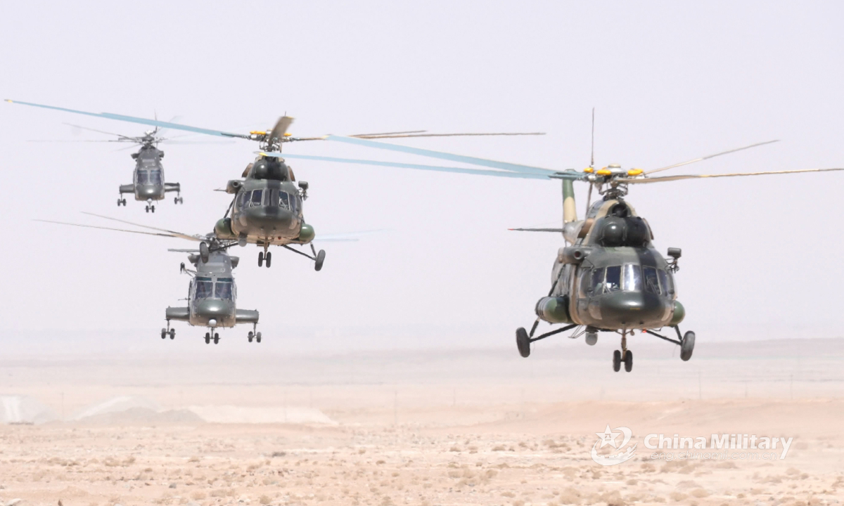 A group of helicopters attached to an army aviation brigade under the PLA 76th Group Army fly at an ultralow altitude for formation assault and rapid infiltration in the specialized training exercise in the middle of May, 2022. (eng.chinamil.com.cn/Photo by Wang Pengfei)