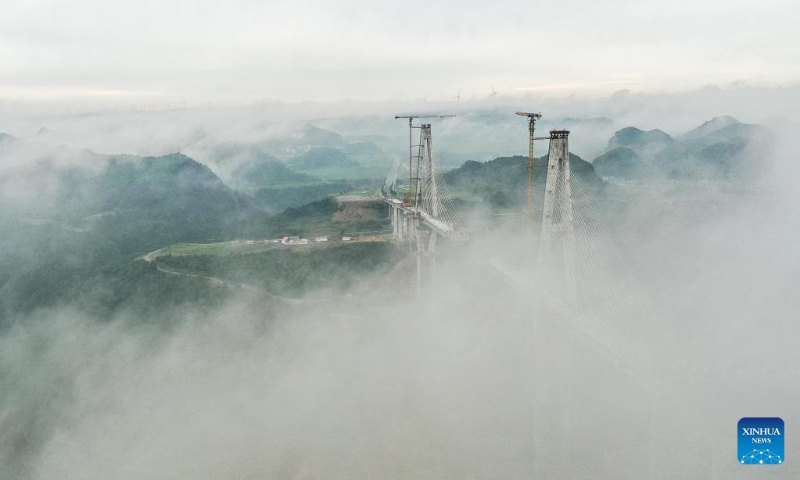 Aerial photo taken on June 14, 2022 shows the construction site of Duohua super major bridge in Longli County, southwest China's Guizhou Province. (Xinhua/Yang Wenbin)