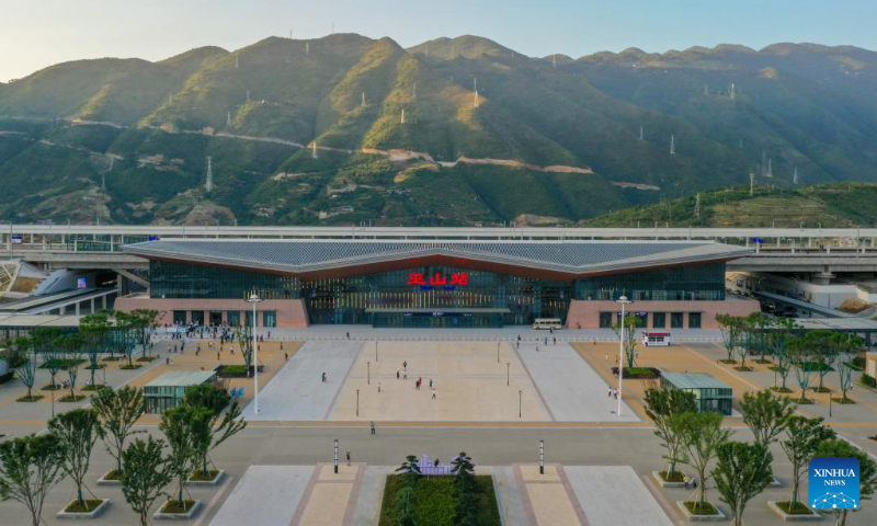 Aerial photo taken on June 13, 2022 shows the Wushan Railway Station in Wushan County, southwest China's Chongqing Municipality, on the high-speed railway linking Chongqing and Zhengzhou, capital of central China's Henan Province. The Zhengzhou-Chongqing High-speed Railway will be fully operational in late June, cutting the travel time between the two cities from 8 hours to 4 hours and upgrading the high-speed railway network in central China and southwest China. (Xinhua/Tang Yi)