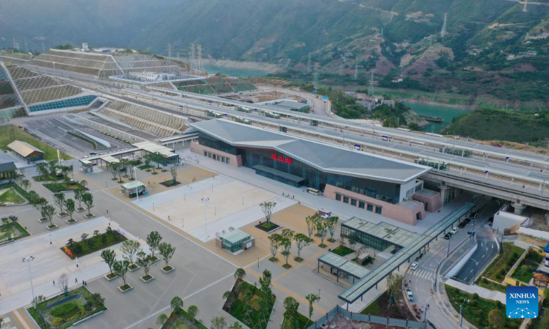Aerial photo taken on June 13, 2022 shows the Wushan Railway Station in Wushan County, southwest China's Chongqing Municipality, on the high-speed railway linking Chongqing and Zhengzhou, capital of central China's Henan Province. The Zhengzhou-Chongqing High-speed Railway will be fully operational in late June, cutting the travel time between the two cities from 8 hours to 4 hours and upgrading the high-speed railway network in central China and southwest China. (Xinhua/Tang Yi)
