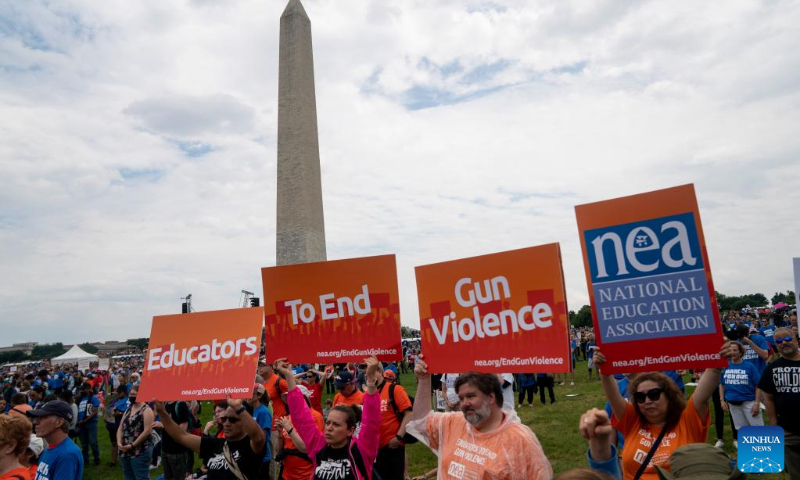 People gather during a rally decrying rising gun violence while urging politicians to take action in Washington, D.C., the United States, June 11, 2022. (Xinhua/Liu Jie)