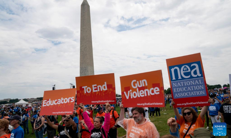 People gather during a rally decrying rising gun violence while urging politicians to take action in Washington, D.C., the United States, June 11, 2022. (Xinhua/Liu Jie)