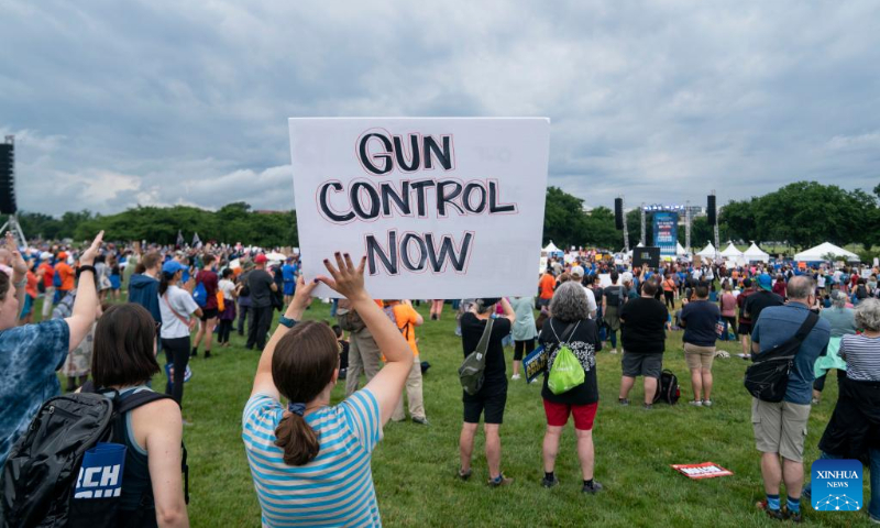 People gather during a rally decrying rising gun violence while urging politicians to take action in Washington, D.C., the United States, June 11, 2022. (Xinhua/Liu Jie)