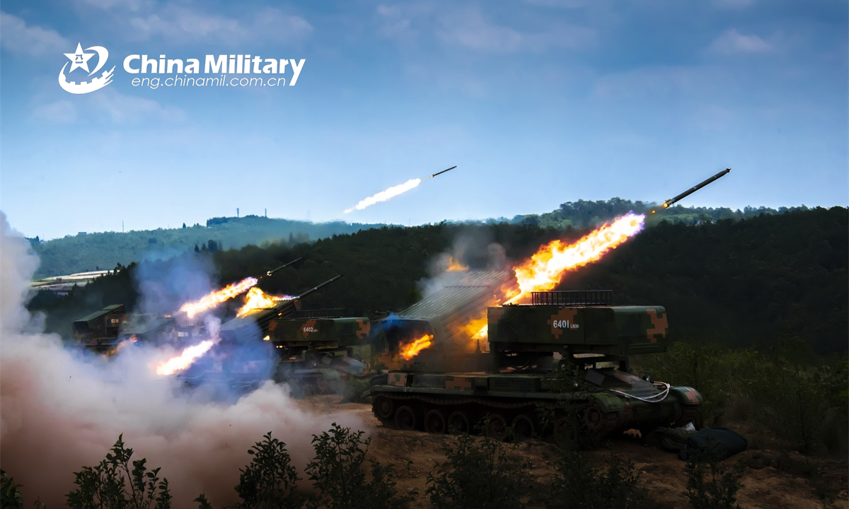 Armored vehicles attached to a combined-arms brigade under the PLA 75th Group Army fire rockets at the mock targets during a live-fire training exercise on May 19, 2022. Photo: China Military
