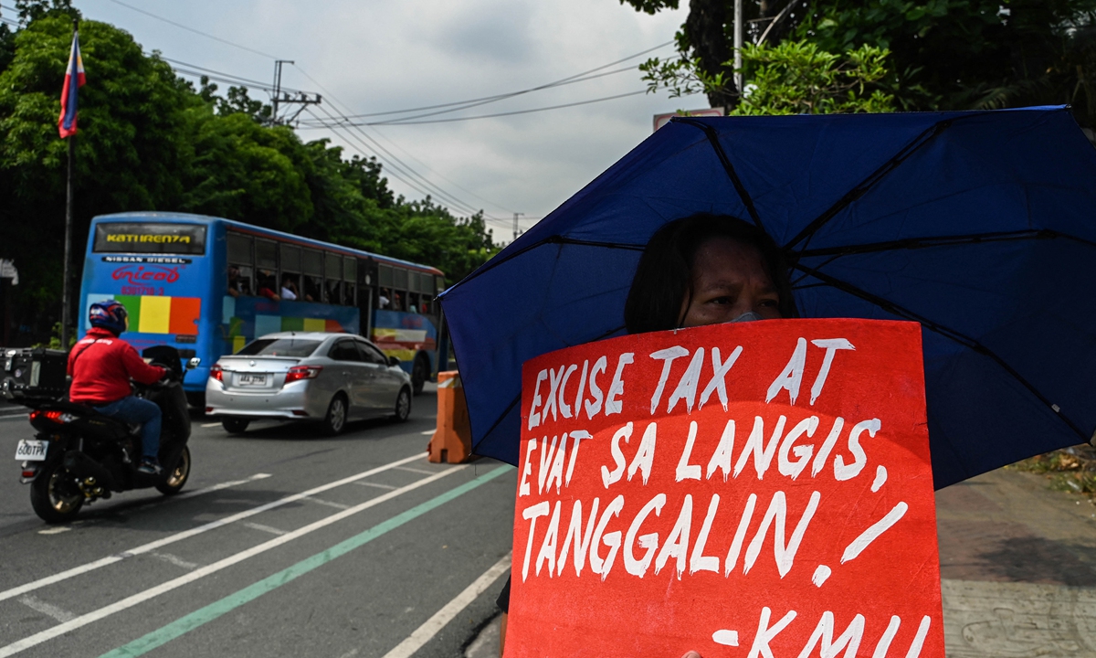 Members of various groups assemble to protest against the looming oil price hike at a gas station in Quezon City, suburban Manila, the Philippines on June 7, 2022. Photo: AFP