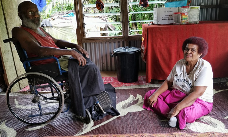 Marika Uluinacera (L), a 68-year-old disabled man who plants mushroom, is seen during an interview with Xinhua at home in Serea village of Naitasiri province, Fiji, May 19, 2022.(Photo: Xinhua)