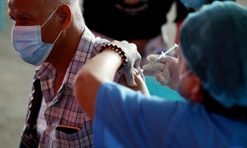 A man receives a dose of COVID-19 vaccine in Yangon, Myanmar, June 6, 2022. Myanmar has fully vaccinated more than 26.8 million people against COVID-19 as of Saturday, according to the Ministry of Health on Sunday.(Photo: Xinhua)