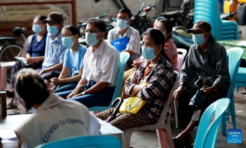 People wait to receive COVID-19 vaccines in Yangon, Myanmar, June 6, 2022. Myanmar has fully vaccinated more than 26.8 million people against COVID-19 as of Saturday, according to the Ministry of Health on Sunday.(Photo: Xinhua)