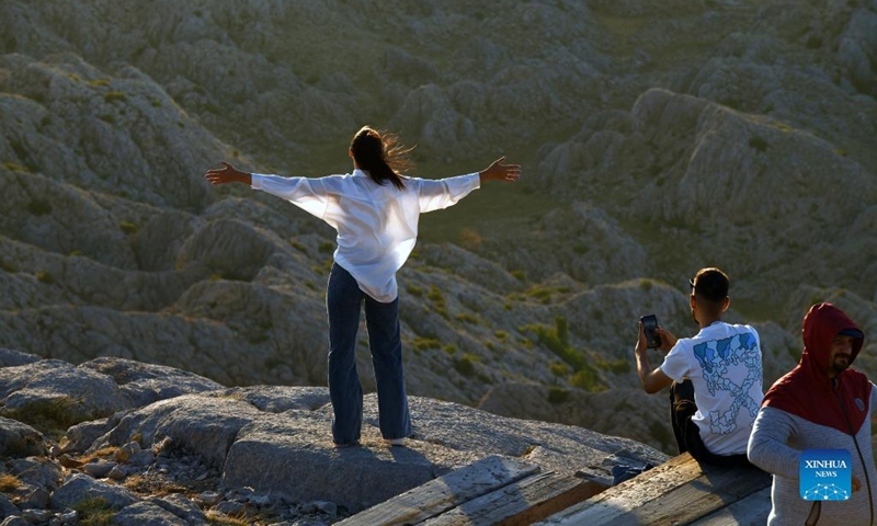 People visit the tomb-sanctuary on Mount Nemrut in Adiyaman Province, Turkey, on June 7, 2022. Mount Nemrut (Nemrut Dag) was inscribed on UNESCO World Heritage List in 1987. On Mount Nemrut, the mausoleum of Antiochus I, who reigned over Commagene, a kingdom founded north of Syria and the Euphrates after the breakup of Alexander's empire, is one of the most ambitious constructions of the Hellenistic period.(Photo: Xinhua)