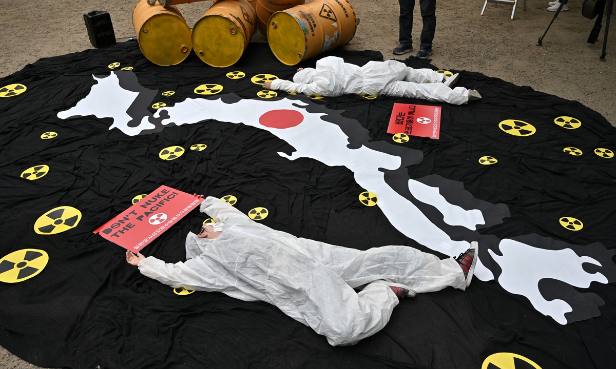 South Korean environmental activists perform during a protest in Seoul, South Korea against Japan's plan to discharge Fukushima radioactive water into the sea, as they mark World Oceans Day on June 8, 2022. Photo: AFP