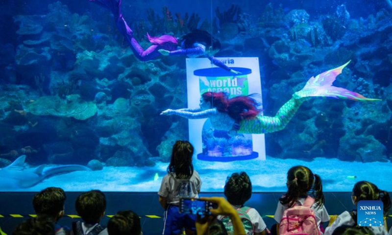 Divers perform during an underwater mermaid show on the occasion of World Oceans Day at Aquaria KLCC in Kuala Lumpur, Malaysia, June 8, 2022. Malaysia's biggest oceanarium Aquaria KLCC marked World Oceans Day on Wednesday with a ceremony here to remind the public of the impact of human actions on the ocean and raise awareness of the importance of sustainable marine management.(Photo: Xinhua)