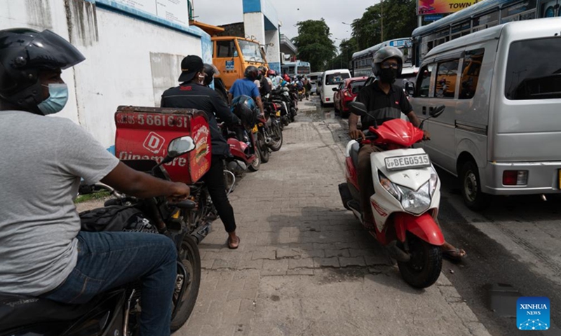 Vehicles queue for fuel on a street in Colombo, Sri Lanka on June 6, 2022. Sri Lankan Prime Minister Ranil Wickremesinghe said here on Tuesday the next three weeks would be tough as the nation is facing a severe economic crisis, urging citizens to use fuel and gas sparingly.(Photo: Xinhua)