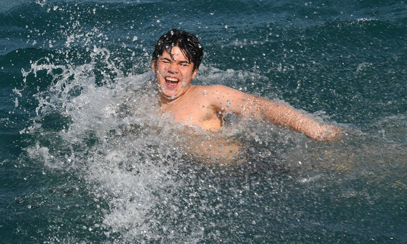 A boy swims in the Bosphorus Strait in Istanbul, Turkey on June 18, 2022.(Photo: Xinhua)