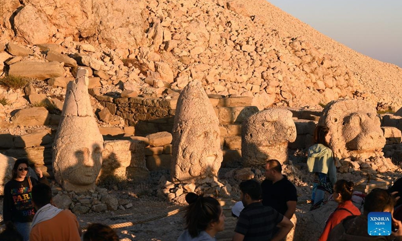 People visit the tomb-sanctuary on Mount Nemrut in Adiyaman Province, Turkey, on June 7, 2022. Mount Nemrut (Nemrut Dag) was inscribed on UNESCO World Heritage List in 1987. On Mount Nemrut, the mausoleum of Antiochus I, who reigned over Commagene, a kingdom founded north of Syria and the Euphrates after the breakup of Alexander's empire, is one of the most ambitious constructions of the Hellenistic period.(Photo: Xinhua)