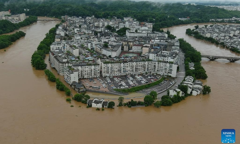Aerial photo taken on June 20, 2022 shows flooded areas of Wuyuan County, east China's Jiangxi Province. East China's Jiangxi Province on Monday issued a red alert for floods, as local hydrological stations registered water in local rivers at warning levels. The heavy rain that lashed Jiangxi has brought the first floods this year in Changjiang River and Xiuhe River in the province, according to the provincial hydrological monitoring center.(Photo: Xinhua)