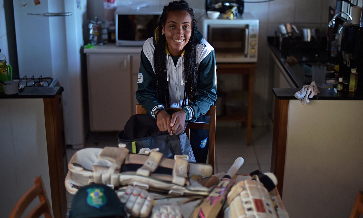 Lindsay Mariano Vilas Boas, from the Cricket Brasil professional women's team, poses at her home in Poco de Caldas, Brazil on May 24, 2022. Photo: AFP