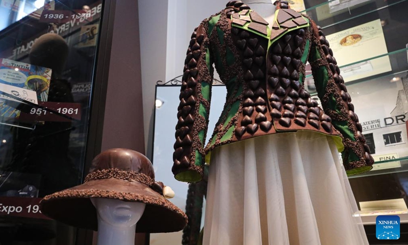 A hat and a jacket made from chocolate are displayed in the Belgian Chocolate Village in Brussels, Belgium, June 9, 2022. The Belgian Chocolate Village is a museum to showcase the knowledge, history and culture related to chocolate.(Photo: Xinhua)