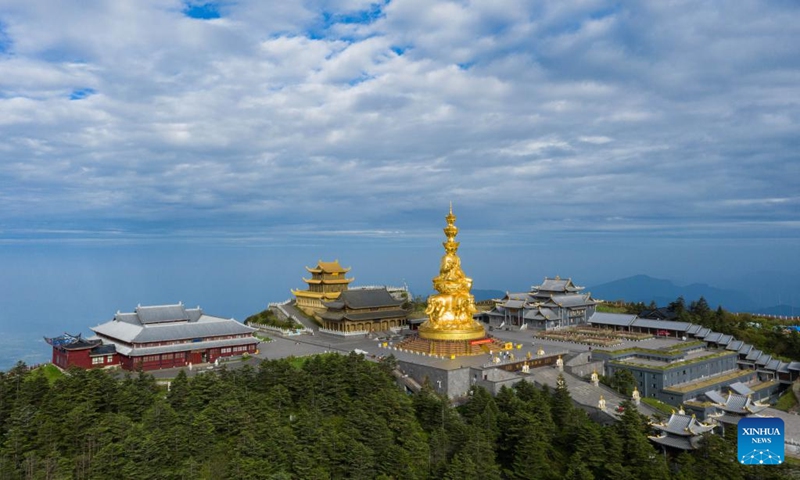 Aerial photo taken on June 5, 2022 shows the scenery of Mount Emei in southwest China's Sichuan Province. Mount Emei, located in southwest China's Sichuan Province, is an area of striking scenic beauty, notable for its lofty mountain and lush vegetation. It is also of great spiritual and cultural significance, in which there are archaeological sites, important architecture, tombs, ritual spaces, and collections of cultural artefacts, including sculpture, stone inscriptions, calligraphy, and paintings, among other traditional arts.(Photo: Xinhua)