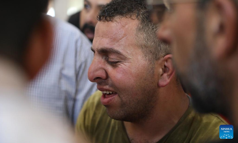 A relative mourns during the funeral of Mahmoud Abu Ahyour in the town of Halhul near the West Bank city of Hebron, on June 9, 2022. A Palestinian was killed on Thursday during clashes with the Israeli soldiers in the town of Halhul near the southern West Bank city of Hebron, according to Palestinian medics and eyewitnesses.(Photo: Xinhua)