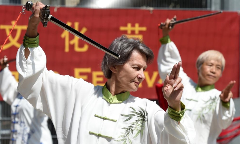 Martial art lovers practice traditional Chinese sword dance during a Shaolin cultural festival in Vienna, Austria, June 11, 2022.Photo:Xinhua