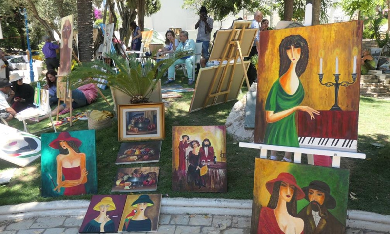 Paintings are displayed in the town of Sidi Bou Said in Tunis, Tunisia, June 12, 2022.Photo:Xinhua