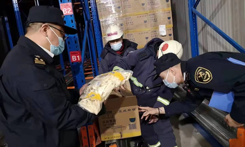 Customs officers checking frozen French fries for exporting