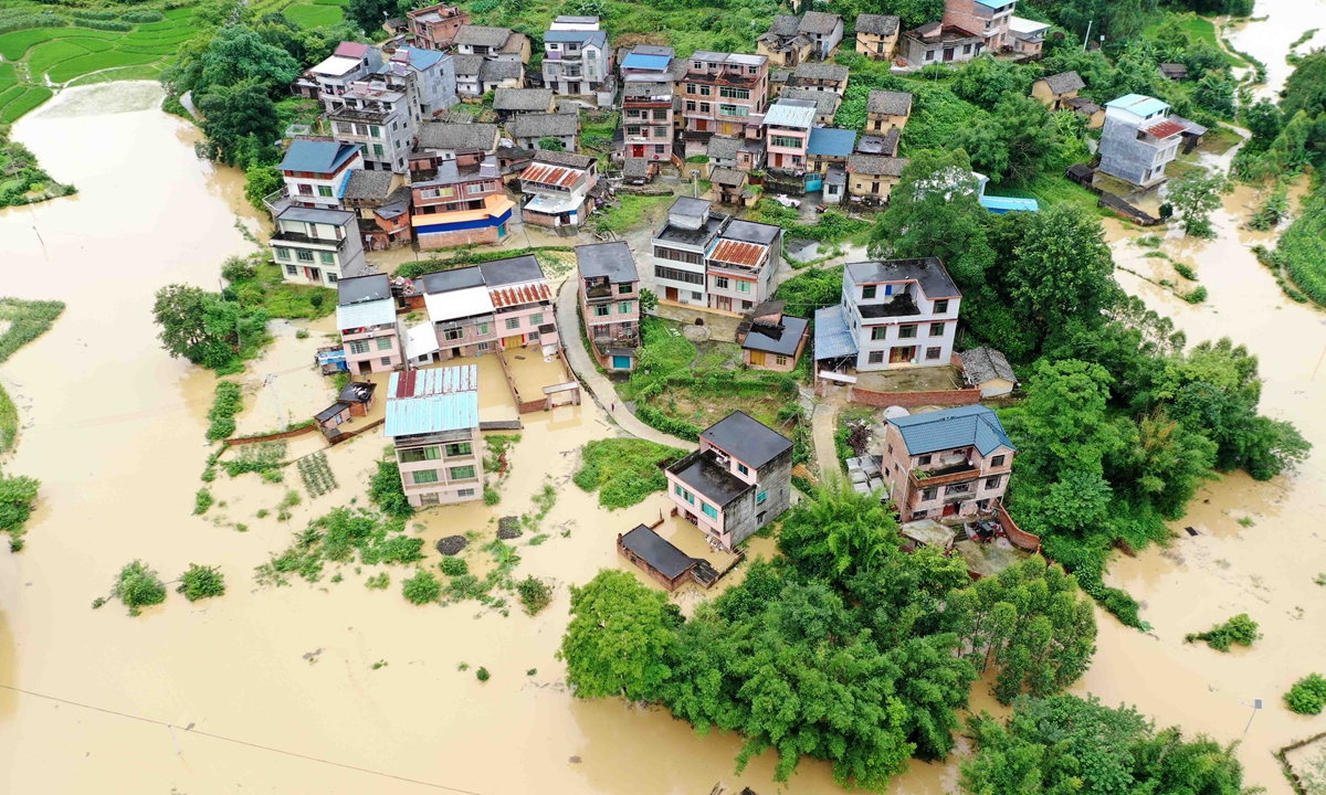 Heavy flood inundates crops and houses in Rongan county, Southwest China's Guangxi Zhuang Autonomous Region on June 13, 2022. The county has seen downpours in recent days and the local meteorological stations updated a rainstorm alert. Photo: VCG