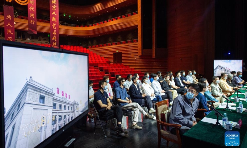 Attendees watch a video during a symposium marking the 70th anniversary of the founding of the Beijing People's Art Theater in Beijing, capital of China, June 12, 2022.Photo:Xinhua