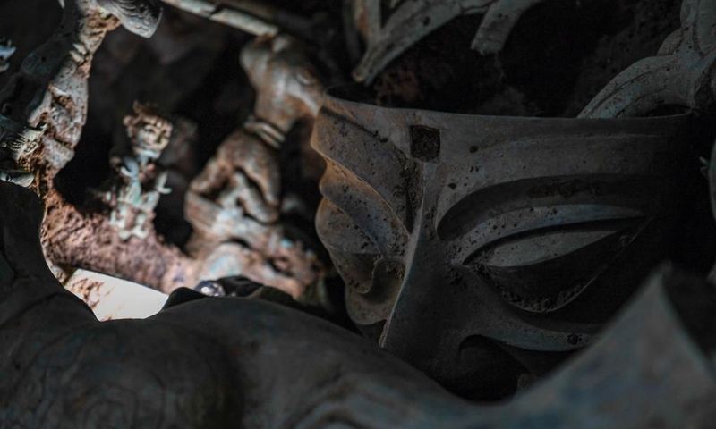 Photo taken on June 1, 2022 shows a bronze mask excavated from the No.8 sacrificial pit at Sanxingdui Ruins site in southwest China's Sichuan Province. Archaeologists have recently made some stunning discoveries at the famed Sanxingdui Ruins site in southwest China's Sichuan Province.

A treasure trove of exquisite bronze, gold and jade wares, including at least 10 bronzewares unearthed for the first time in the history of human civilization, have been excavated at the site. (Xinhua/Wang Xi)
