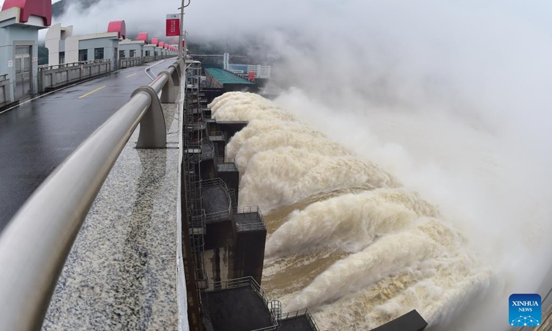 Photo taken on June 13, 2022 shows water gushing out from a gate of the Shuikou Hydropower Station in southeast China's Fujian Province. China's Ministry of Water Resources initiated a level-IV emergency response for flood control on June 12 as heavy rain is expected to sweep the country's southern areas in the coming days.(Photo: Xinhua)