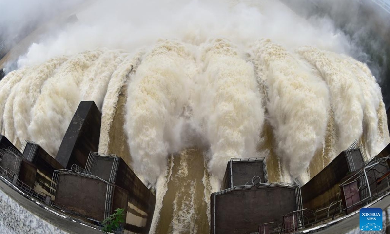 Photo taken on June 13, 2022 shows water gushing out from a gate of the Shuikou Hydropower Station in southeast China's Fujian Province. China's Ministry of Water Resources initiated a level-IV emergency response for flood control on June 12 as heavy rain is expected to sweep the country's southern areas in the coming days.(Photo: Xinhua)