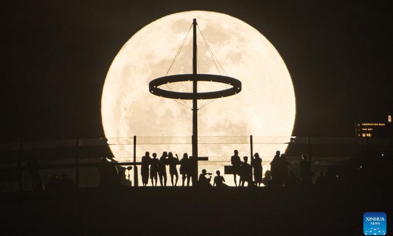A supermoon is seen in the sky above Singapore's Marina Bay on June 14, 2022.(Photo: Xinhua)