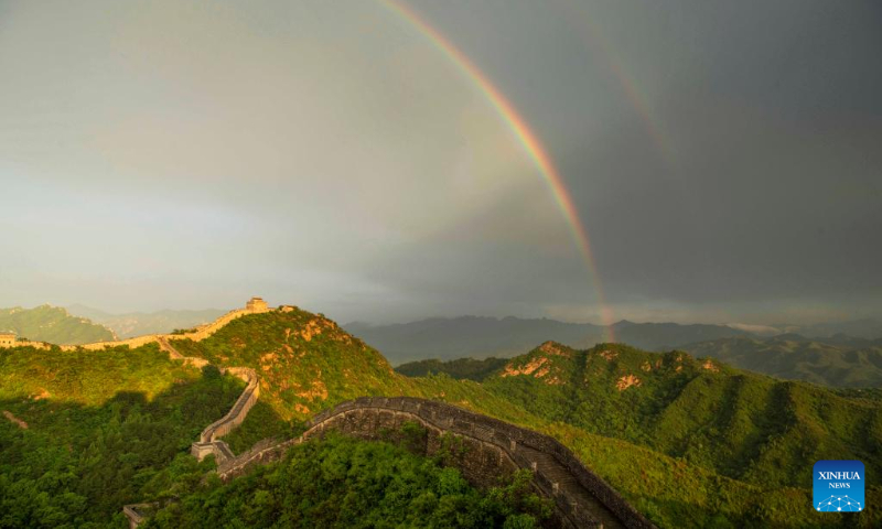 A double rainbow appears in the sky over the Jinshanling Great Wall in Luanping County, north China's Hebei Province, June 14, 2022. (Photo by Liu Mancang/Xinhua)