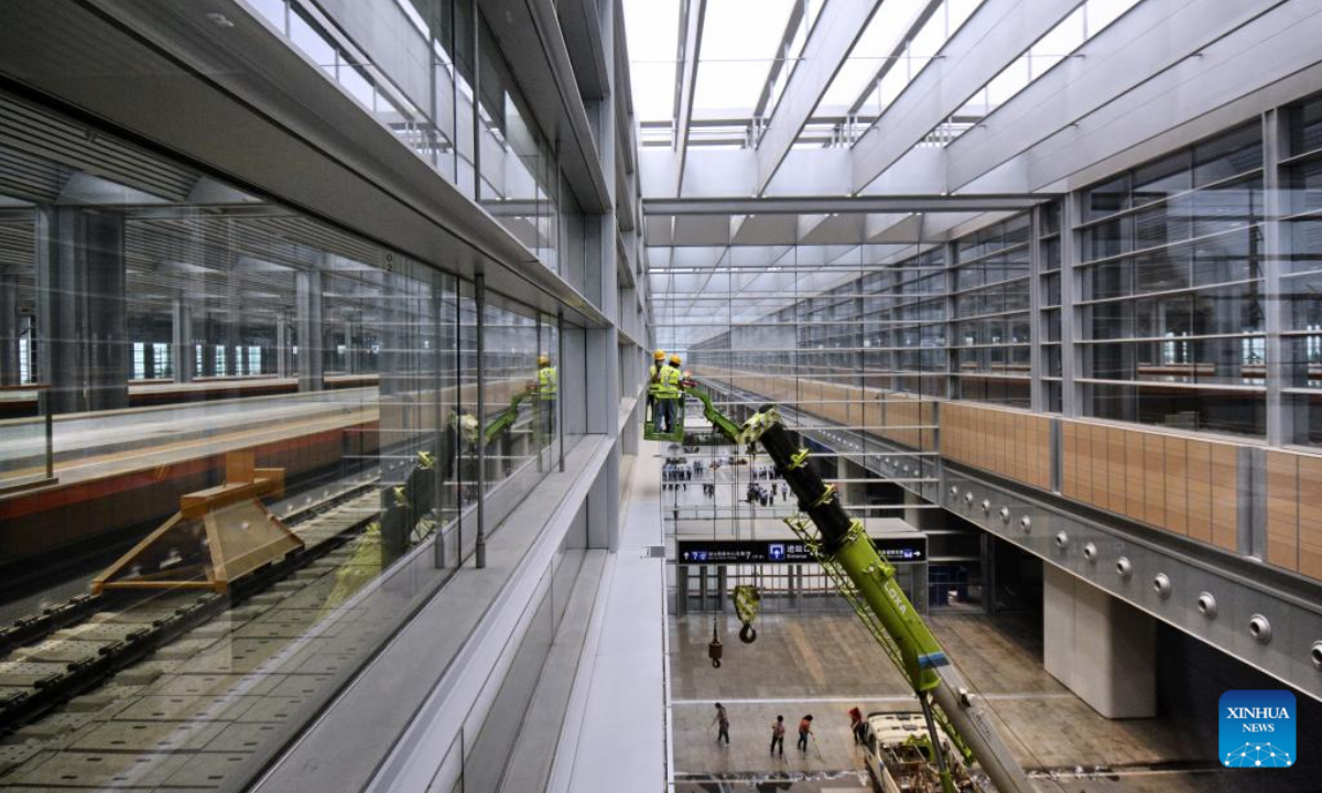 Workers are seen at Beijing Fengtai Railway Station, which will be put into service soon, in Beijing, capital of China, June 16, 2022. Photo:Xinhua
