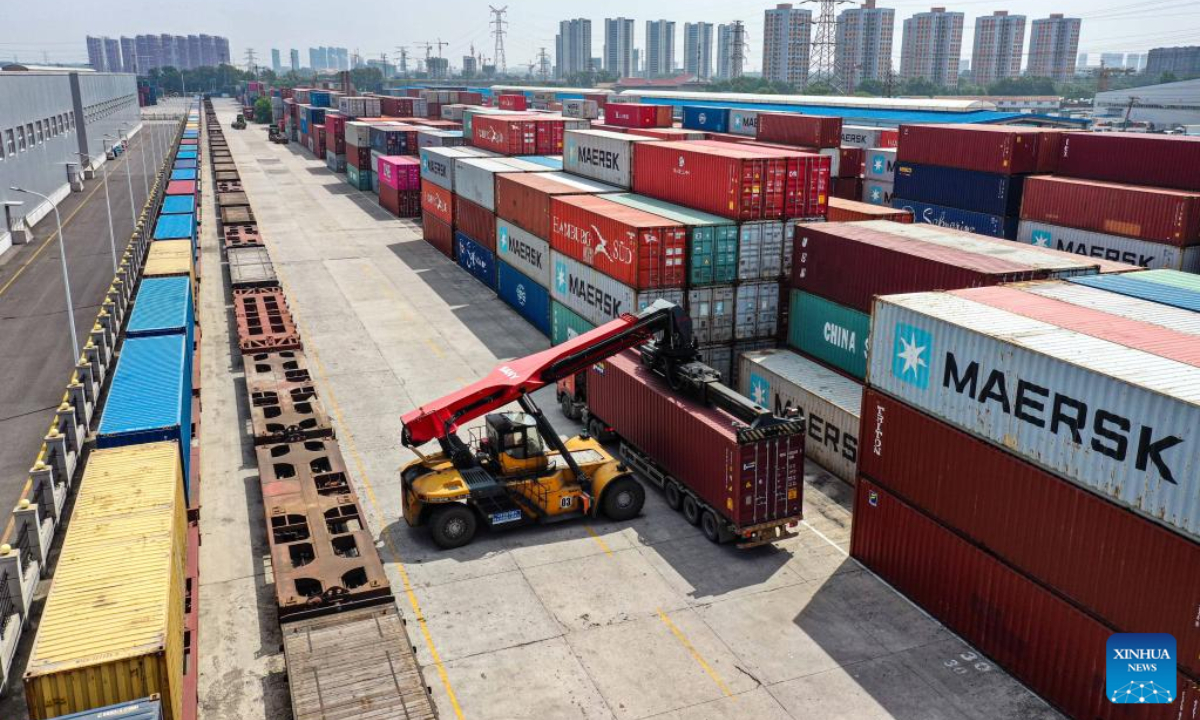 In this aerial photo, a crane loads a container onto a China-Europe freight train at the Shenyang East Railway Station in Shenyang, northeast China's Liaoning Province, June 16, 2022. Photo:Xinhua