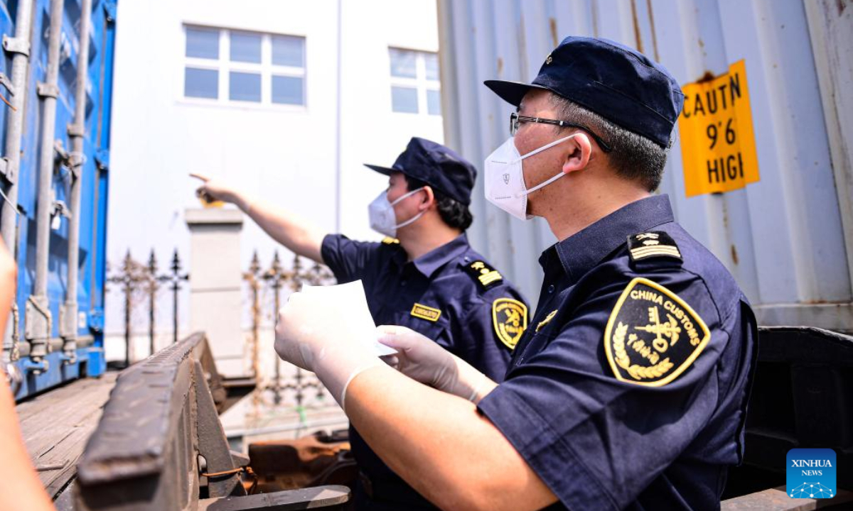 Customs officers inspect containers aboard a China-Europe freight train at the Shenyang East Railway Station in Shenyang, northeast China's Liaoning Province, June 16, 2022. Photo:Xinhua