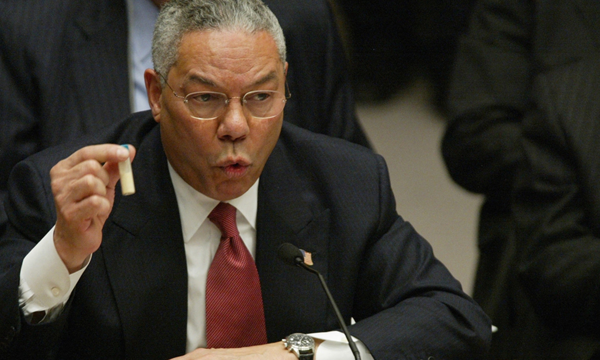 Former US secretary of state Colin Powell holds up a vial of what was later found to be washing powder as evidence of 