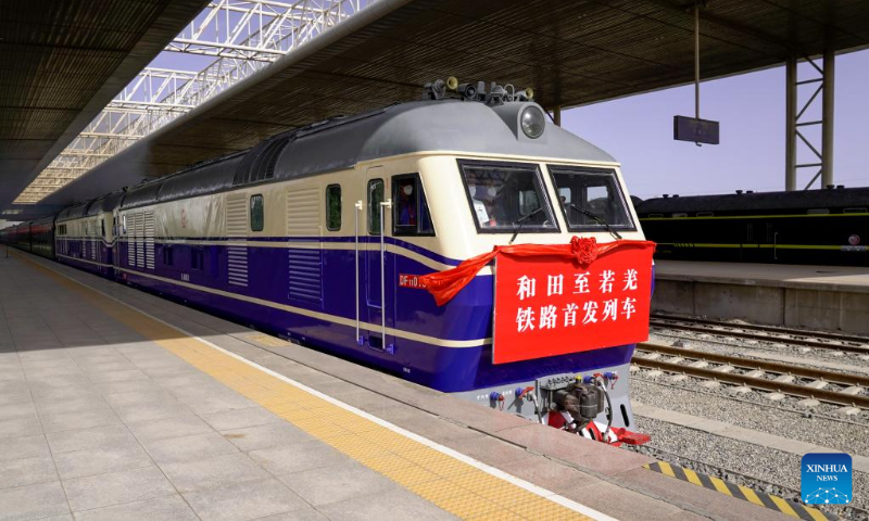 The first train of the Hotan-Ruoqiang Railway pulls out of Hotan Railway Station in Hotan, northwest China's Xinjiang Uygur Autonomous Region, June 16, 2022. The last section of a 2,712-km rail loop line around China's largest desert, the Taklimakan, in the country's northwesternmost Xinjiang Uygur Autonomous Region was put into operation on Thursday. The opening of the Hotan-Ruoqiang rail line will enable trains to skirt a full circle around a desert for the first time in the world, according to the China State Railway Group Co., Ltd. (China Railway). (Xinhua/Ding Lei)