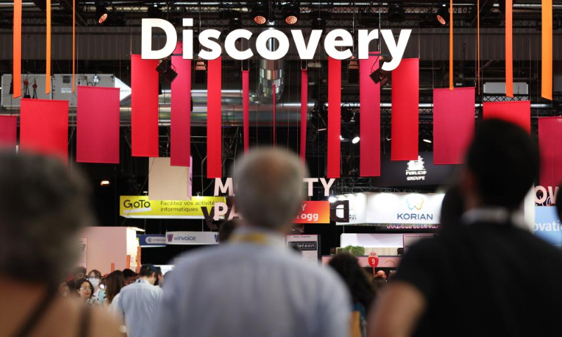 Attendees visit the VivaTech technology startups and innovation fair during its opening day in Paris, France, June 15, 2022. The 2022 VivaTech technology startups and innovation fair kicked off here on Wednesday, and will last until Saturday. More than 2,000 exhibitors participated in the event. VivaTech is the world's rendezvous for startups and leaders to celebrate innovation and the power of technology in transforming business and society. (Xinhua/Gao Jing)