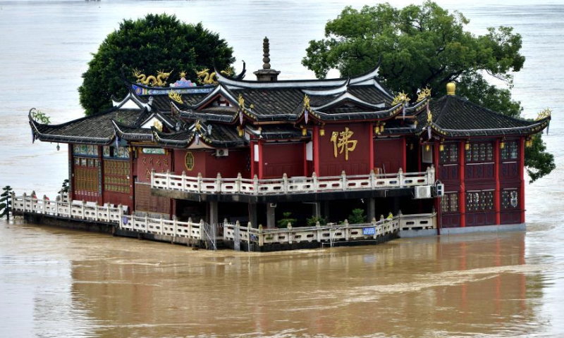 The Jinshan Temple is flooded by the rising Wulongjiang River water in Fuzhou, Fujian Province, June 14, 2022. (Photo: China News Service/Zhang Bin)