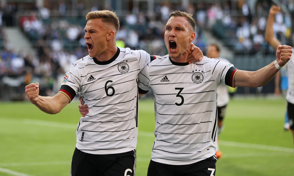 Joshua Kimmich (left) of Germany celebrates scoring their side's first goal with teammate David Raum on 
June 14, 2022 in Moenchengladbach, Germany. Photo: VCG