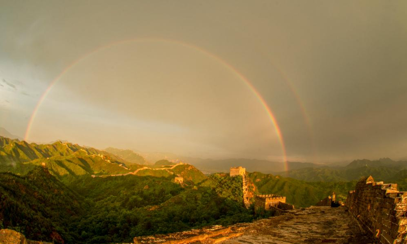 A double rainbow appears in the sky over the Jinshanling Great Wall in Luanping County, north China's Hebei Province, June 14, 2022. (Photo by Liu Mancang/Xinhua)