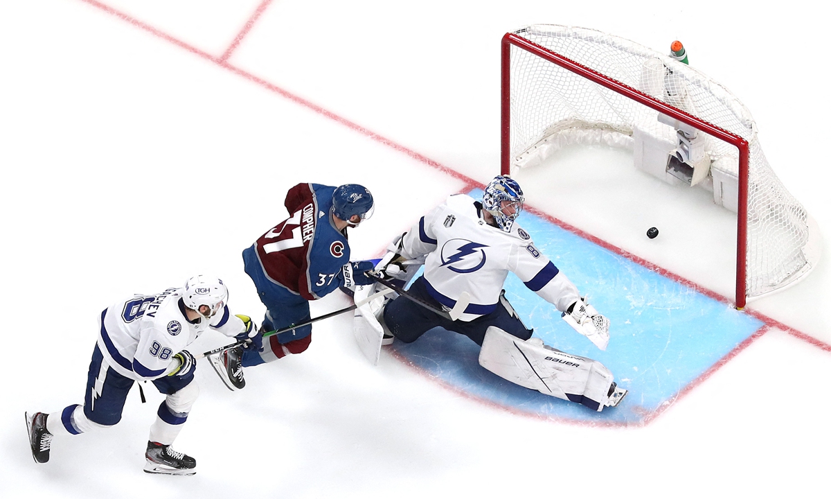 Andrei Vasilevskiy (right) of the Tampa Bay Lightning has a goal scored against him by Andre Burakovsky of the Colorado Avalanche on June 15, 2022 in Denver, Colorado. Photo: AFP